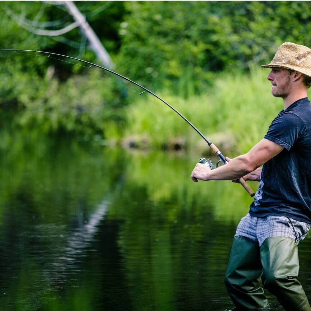 Young Fisherman Catching a big Fish